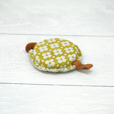 Cohana Yuzen Leather Tape Measure shown in a stack - yellow shown | Yarn Worx