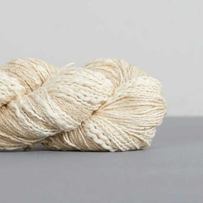 Feza Yarns Alp Natural - Hand-Tied Textured Yarn shown in colourway 701 | Yarn Worx