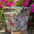 fabric project bag in pink and green sitting on a stool with pin flowers in the background