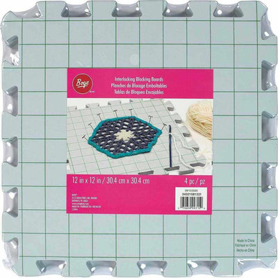 Interlocking blocking boards with a Roue brand packaging label on a green grid background