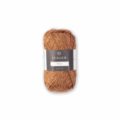 Ball of light brown yarn with a label on a white background