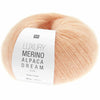 Ball of peach-coloured yarn with a label on a white background | Yarn Worx