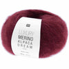 Burgundy yarn ball with a label on a white background | Yarn Worx