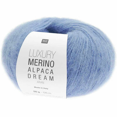 Blue ball of yarn with a label on a white background | Yarn Worx