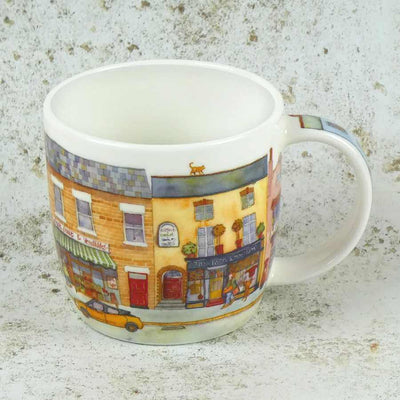 Mug with a colorful street scene design on a textured surface | Yarn Worx