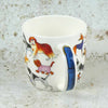 Ceramic mug with dog illustrations on a textured surface | Yarn Worx