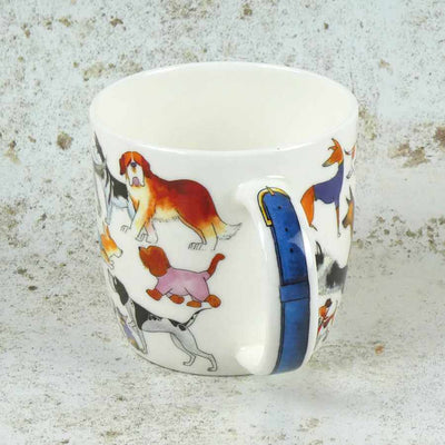 Ceramic mug with dog illustrations on a textured surface | Yarn Worx