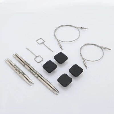 Collection of knitting needles and accessories on a white background  Yarn Worx