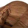 Close-up of a brown leather bag with a visible brand label on a white background | Yarn Worx