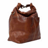 Brown leather handbag on a white background | Yarn Worx