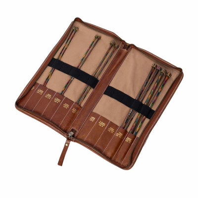 Set of knitting needles in a brown leather case on a white background | Yarn Worx