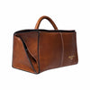 A brown leather project bag with a top handle, shown at a three-quarter angle on a plain white background. The bag features a pebbled leather texture, contrast black stitching, and a small gold logo on the lower right side that reads 'REDESIGNED PROJECT' | Yarn Worx