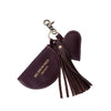 A dark burgundy leather keychain with a heart-shaped charm, a small flap pouch with a snap button, and a long tassel, attached to a copper coloured metal clasp on a white background | Yarn Worx
