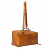 Brown leather duffel bag with a strap on a white background | Yarn Worx
