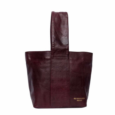 Burgundy leather tote bag with 'RE DESIGNED PROJECT' branding on a white background | Yarn Worx