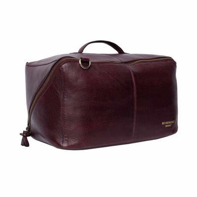 Cherry leather duffel bag on a white background | Yarn Worx