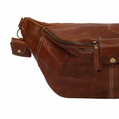 Brown leather bag with a zipper on a white background