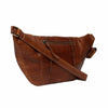 Brown leather bag with a strap on a white background