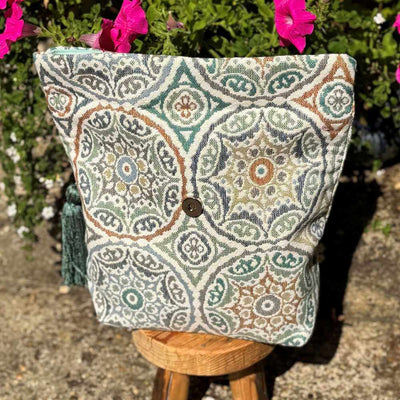 Decorative pillow with a pattern on a stool outdoors