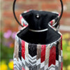 Decorative lantern with a colorful zigzag pattern on a blurred background