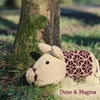 Plum Pudding Knitted Pig Kit Pig-Along shown in colours Dune & Magma | Yarn Worx