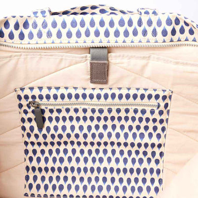 Close-up of a beige bag inside with blue patterned pocket and zipper | Yarn Worx