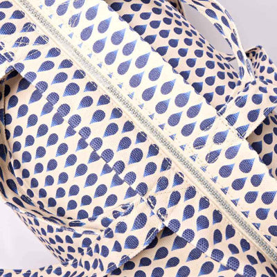 Blue and white patterned fabric with a zipper on a light gray background | Yarn Worx