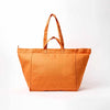 An orange canvas tote bag with two top handles, photographed against a clean white background | Yarn Worx