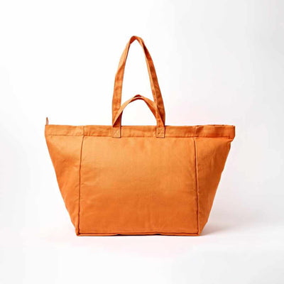 An orange canvas tote bag with two top handles, photographed against a clean white background | Yarn Worx