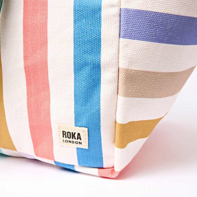 Colorful striped bag with Roka London label on a white background | Yarn Worx