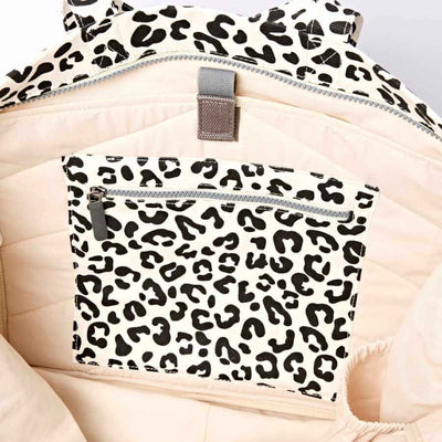 Leopard print inside pocket of the bag with zippers on a beige background | Yarn Worx