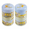 Two cylindrical tins with decorative lids featuring illustrations of buildings and a ginger cat on the lid | Yarn Worx