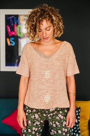 Cropped Tee - Kath Webber - Emma's Practically Perfect Sock - Model is sitting on an armchair | Yarn Worx