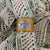 Birdie Parker Designs - Sierra Leather Shawl Cuff - Crochet, shown worn on a shawl | Yarn Worx