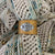 Birdie Parker Designs - Sierra Leather Shawl Cuff - Crochet, shown worn on a shawl | Yarn Worx