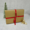 Christmas Yarn Gift in a gold gift tied with a red ribbon | Yarn Worx