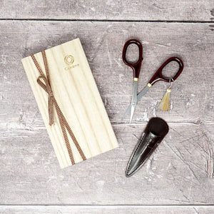 Cohana Lacquer Scissors from Seki shown in red and brown with a leather pouch | Yarn Worx