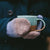 The Crochet Project - Crochet Yeah! person wearing mittens holding a mug of hot drink | Yarn Worx